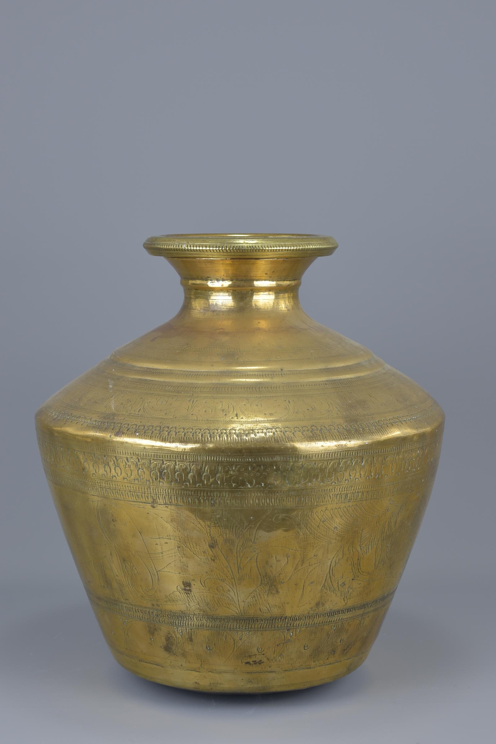 A large Indian polished bronze water vessel.