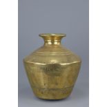 A large Indian polished bronze water vessel.