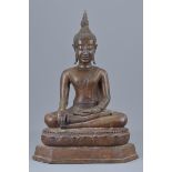 A Thai 19th century bronze seated figure. 39cm tall