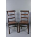 A pair of Chinese hardwood chairs. 40cm wide seat. 87cm tall.