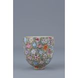 A Chinese 19th Century million-flowers porcelain tea cup. Four character mark to base. 6.5cm x 6cm