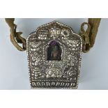 A 19th century Tibetan prayer box with strap and pouch embroidered with dragon.