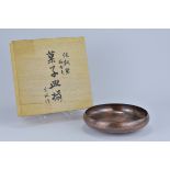 A 20th century Japanese Kinsho-Do pure copper hammer beaten bowl  with floral pattern design with ca