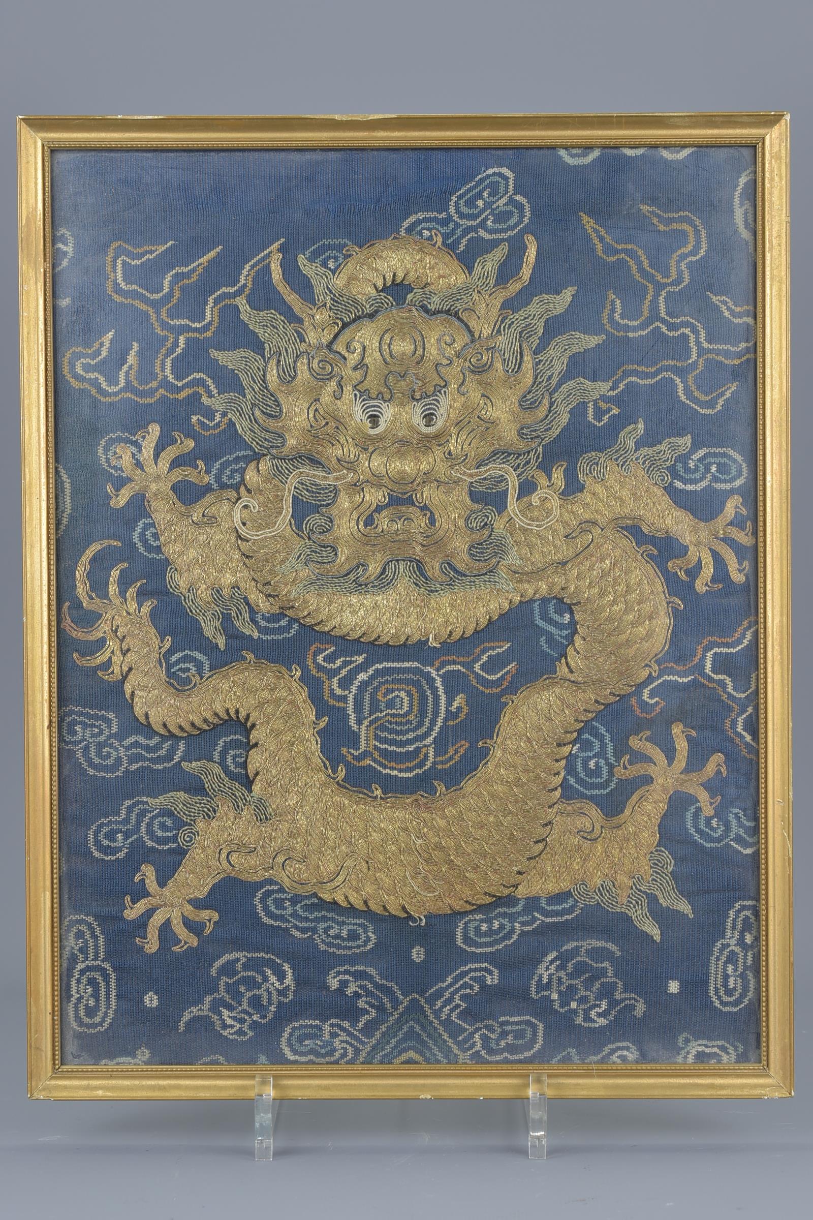 A Chinese 19th century framed embroidery of a dragon