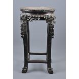 A Chinese 19th century hardwood plant stand with slight damage. 61cm tall