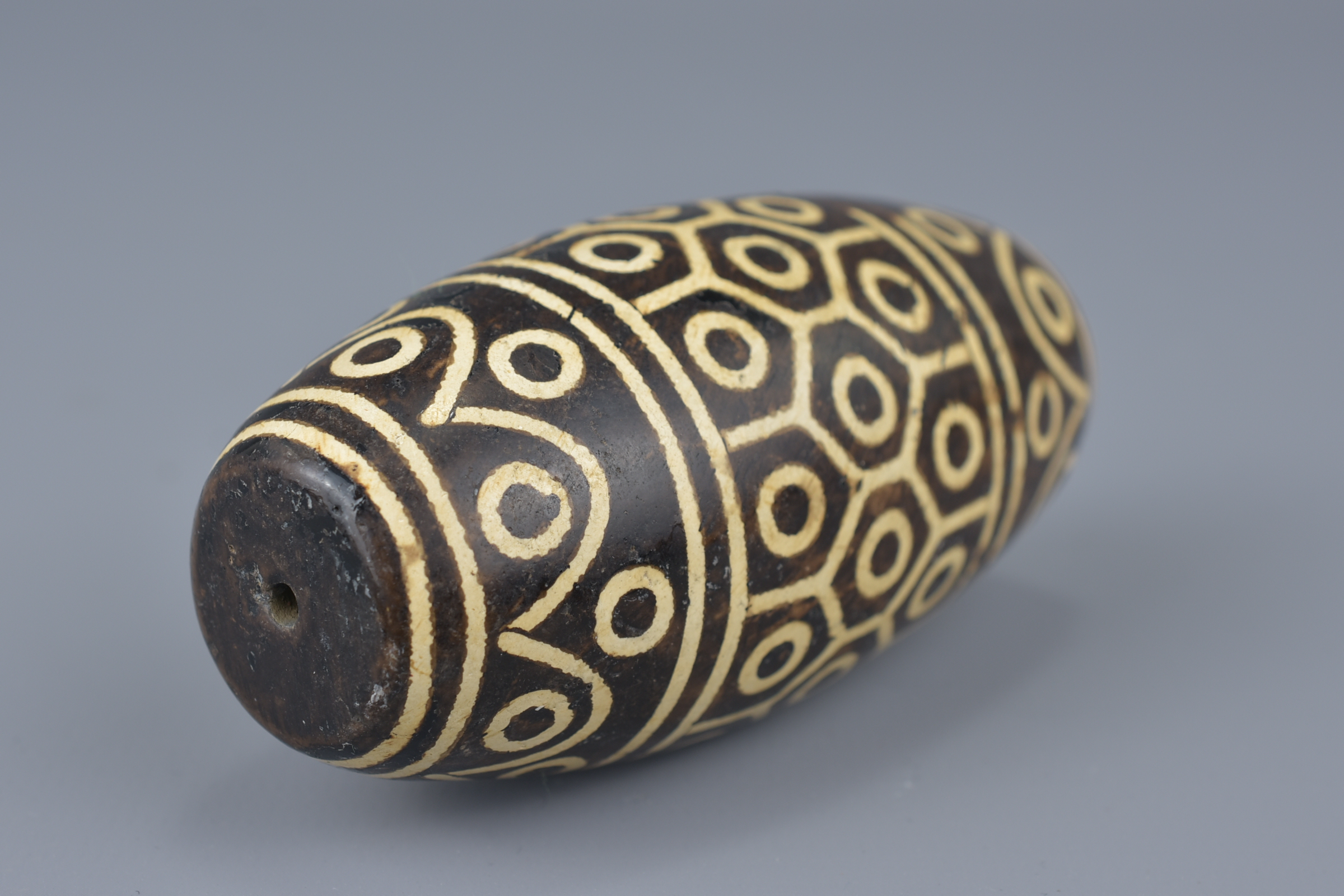 A large Tibetan painted pottery bead Tianzhu style. 9cm width - Image 4 of 6