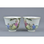 A pair of Chinese Republican period porcelain tea cups decorated with figures and bats. Six characte