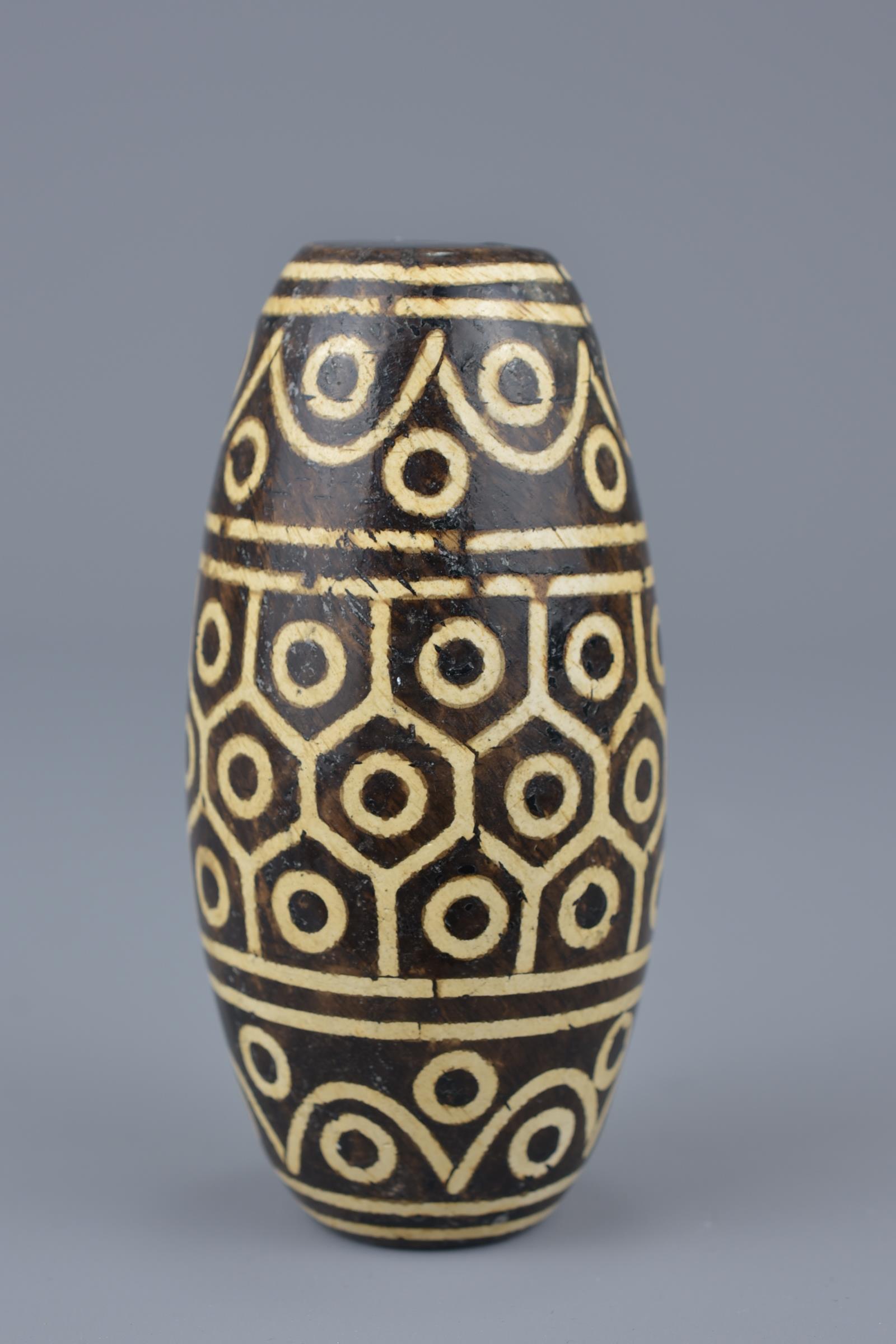 A large Tibetan painted pottery bead Tianzhu style. 9cm width