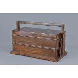 A Chinese Huanghuali wood two-tired picnic box rectangular form with handle and baitong mounts. Fitt
