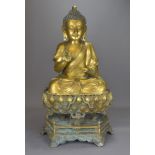 A large Chinese bronze seated Buddha on separate lotus stand. 78cm tall