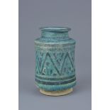 A Middle Eastern blue-glazed pottery vase possibly 12th century. 12cm height