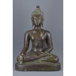 A large Thai 18th/19th century bronze seated buddha. 64cm tall