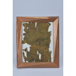 A framed Tibetan silk fragment. 31cm x 26cm