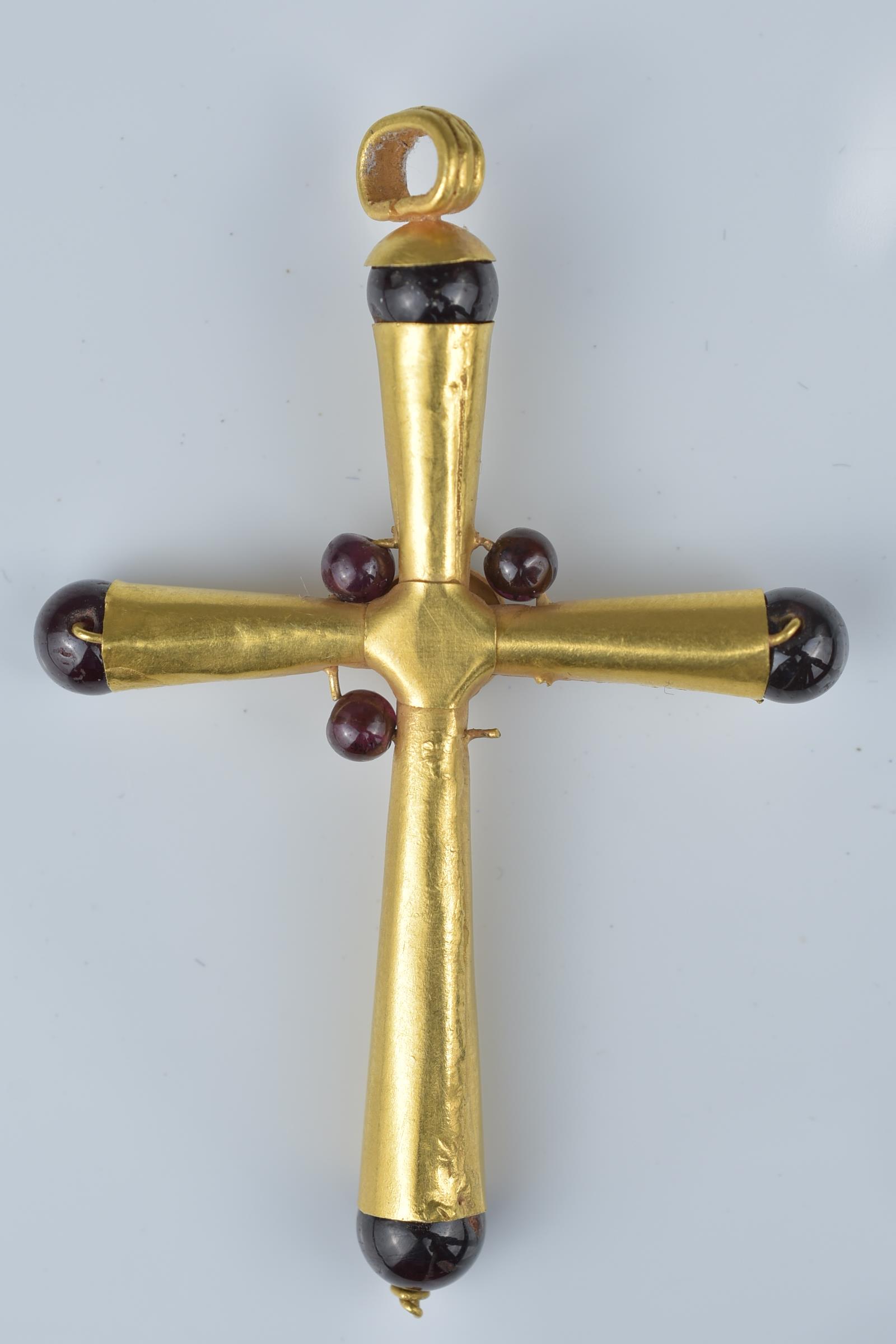 A gold cross pendant with garnet stone (one stone missing). 6cm height - Image 2 of 2
