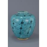 An Islamic 18th/19th century blue-glazed jar. 25 cm tall.