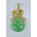 A Chinese carved jade pendant with 18K gold and diamond in ribbon  design.