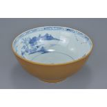 A Chinese 18th century tea-dust brown glazed export porcelain bowl with underglaze blue interior dep