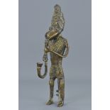 An West African standing bronze figure with pipe. 20Cm tall