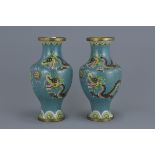 A pair of Chinese cloisonné enamel vases decorated with dragons. 22Cm tall (2)