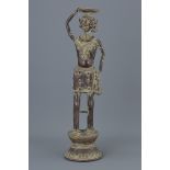 An Eastern standing bronze oil lamp figure. 43Cm tall