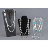 A group of fresh water pearl necklaces with turquoise beads. Three necklaces and one bracelet.