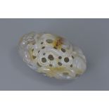 A Chinese agate hollow carving with dragon and lotus. 9cm x 5cm