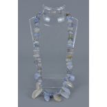 A lavender agate and crystal beaded necklace.