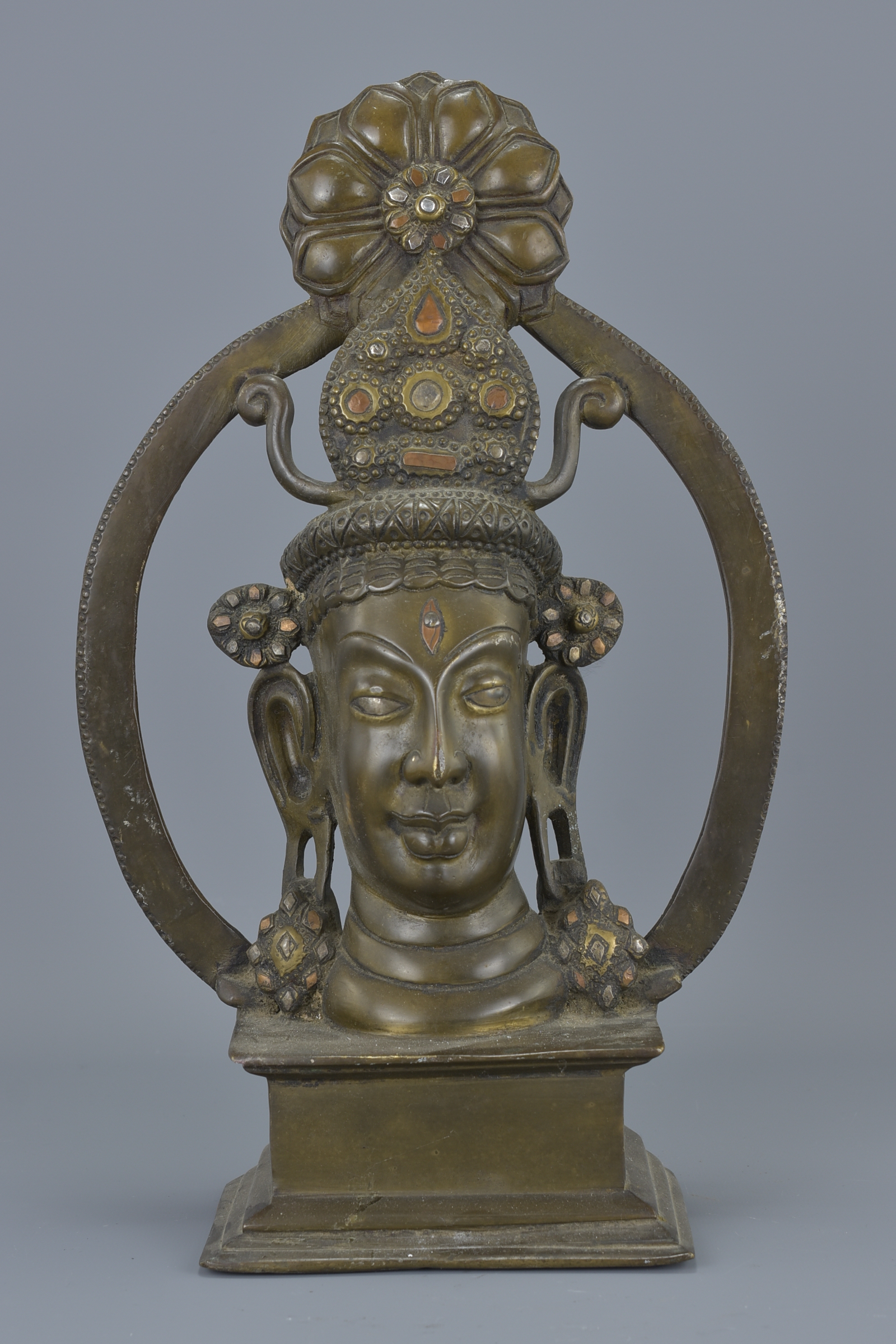 An Eastern bronze figure on stand. 37Cm tall