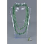 String of 112 Jade Ungraduating Beads together with a Silver Marquise Jade and Marcasite Dress Ring