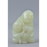 A Chinese 19/20th century pale celadon jade carving of two boys. Size 5.7cm tall x 3.8cm wide