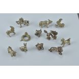 A set of twelve miniature silver metal Chinese Zodiac figures. Approx. 1-1.5cm