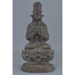 A Chinese bronze figure of seated Guanyin on lotus stand with traces of gold gilding. 30Cm tall