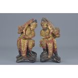 A pair of Chinese carved wooden figures of Gods of Heaven. Gold gilded with red lacquer. 18Cm tall