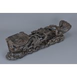 A large Chinese carved hardwood Ruyi sceptre on stand. 46Cm length x 13cm height