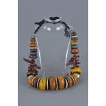 Large Moroccan Silver, Amber resin and Shells in a string necklace. Largest bead 4cm length