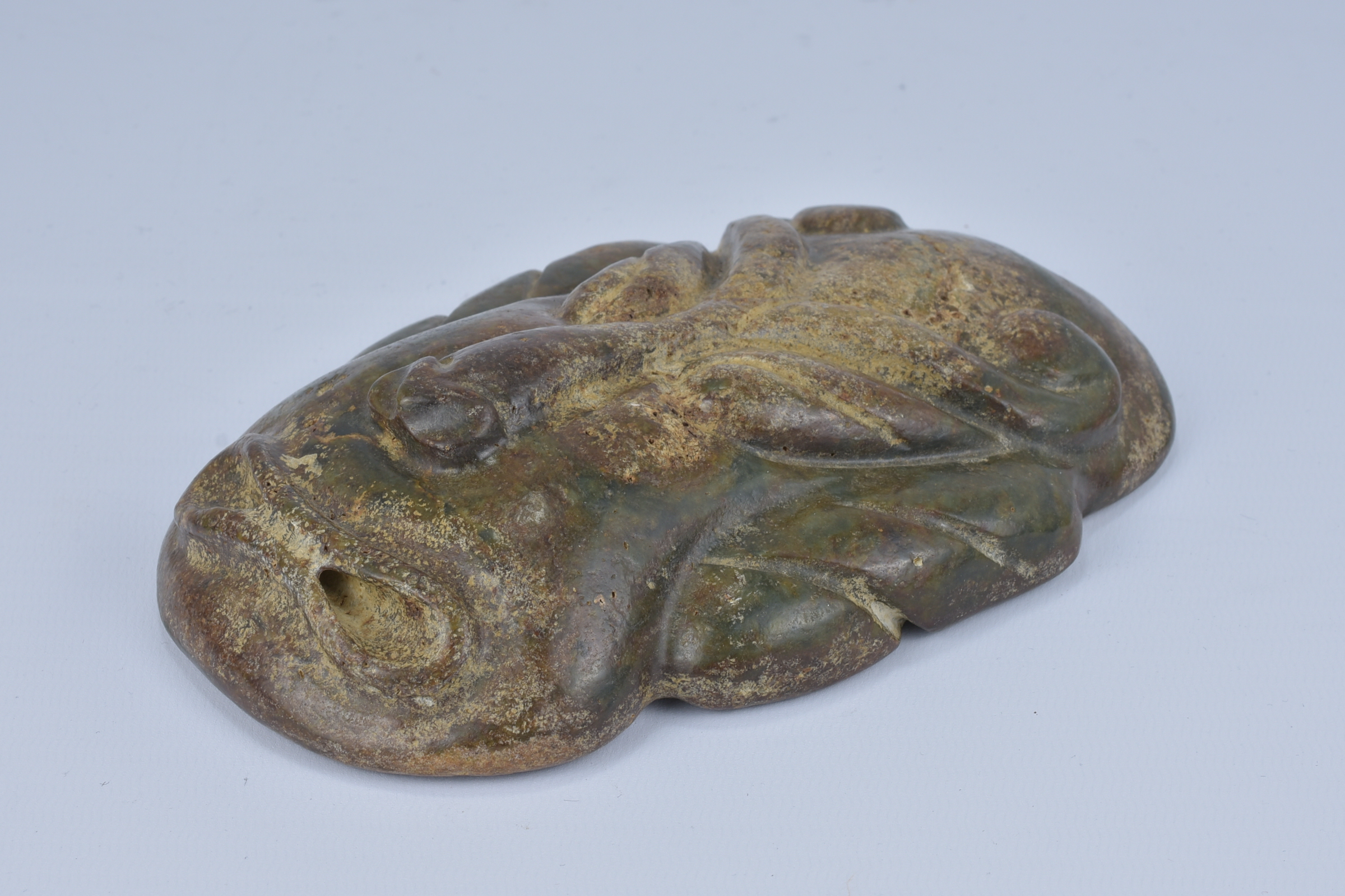 A large archaic style stone mask pendant. 9cm width - Image 3 of 3