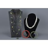 Four items of Jewellery including Three String Pearl Necklace with Silver Clasp, Jade Bangle (a/f),