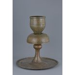 A large 19th century Persian Qajar copper candle holder
