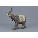 An Indian carved wooden elephant. 25cm x 24cm
