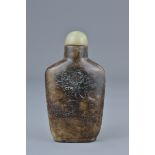 A Chinese brown pale jade snuff bottle with incise