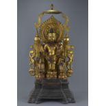 A Chinese gold gilded bronze statue of standing Buddha with two followers each side. A detachable fr