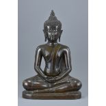 A Thai 18/19th century seated dark bronze figure of seated Buddha. 49Cm tall