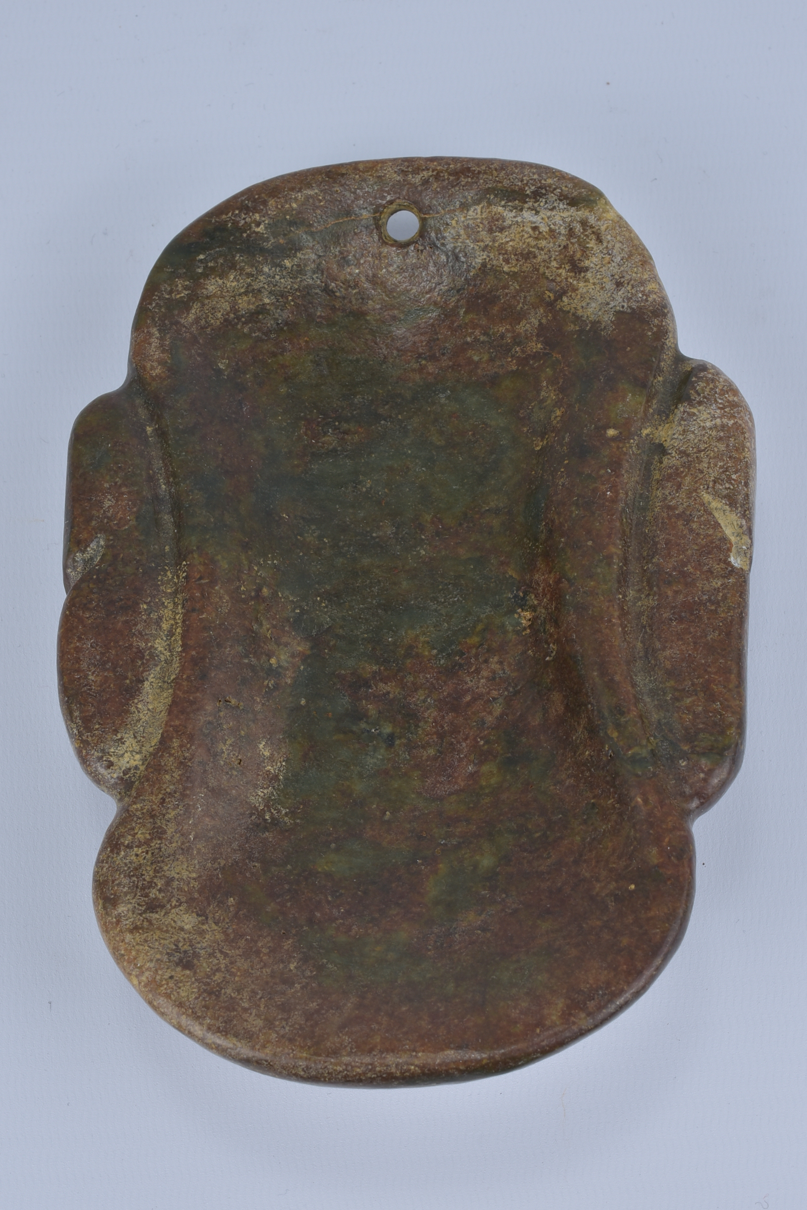 A large archaic style stone mask pendant. 9cm width - Image 2 of 3