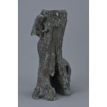 A tall Japanese Meiji period bronze sculpture pot in the form of a tree trunk with monkey holding a