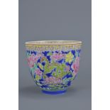 A Chinese Republican period or later egg-shell porcelain cup decorated with three dragons. Four char