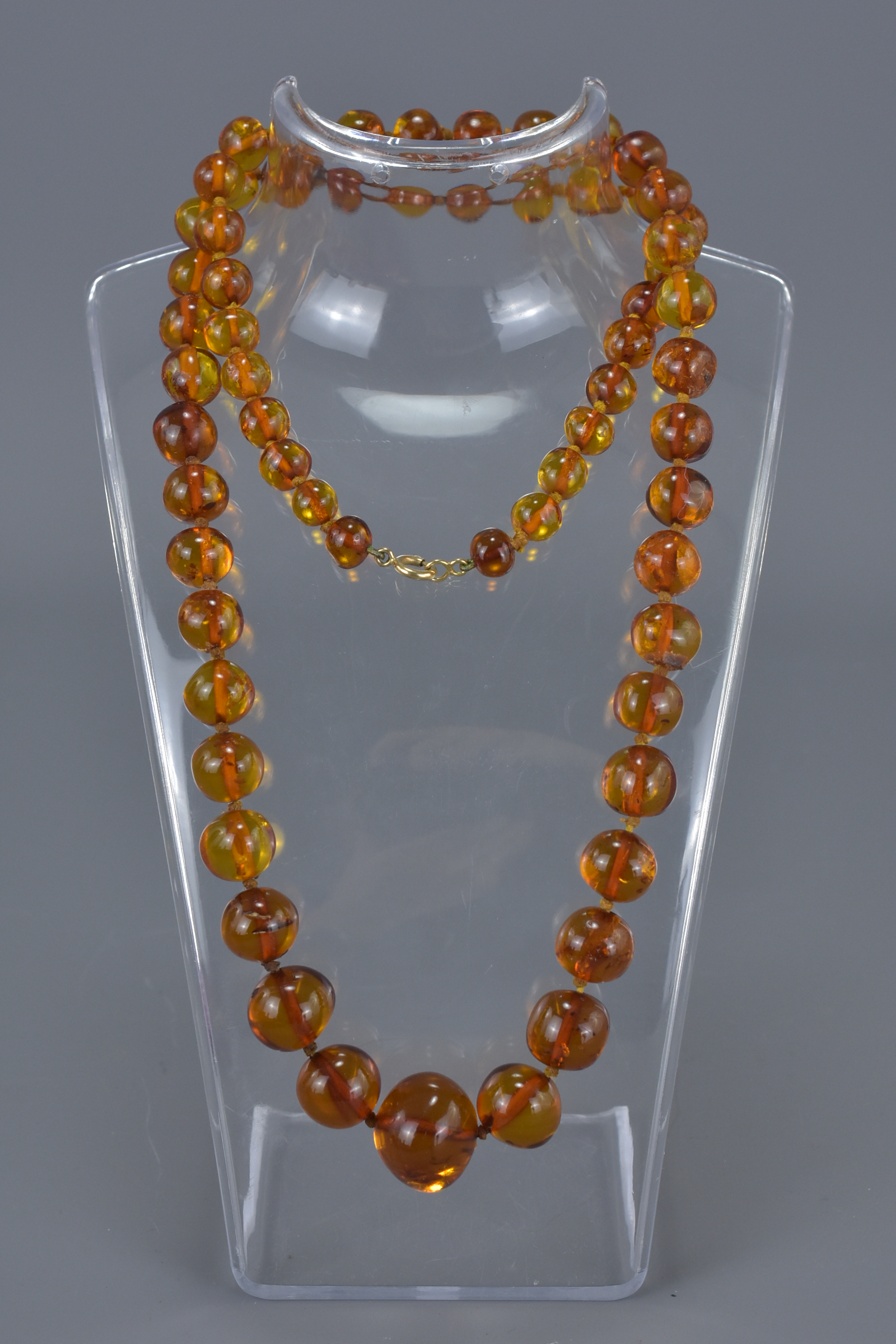 Baltic Clear Amber Bead Necklace containing 63 Graduating Beads, approx. 50 grams