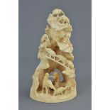 19th century Japanese Ivory Carving of Elephants and Men on and under a Mountain, 12cms