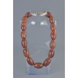 String of 15 Polished Agate Beads, each bead approximately 33mm longs, approximately 47cms long