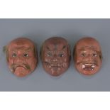 Three Japanese Papier Mache Lacquered and Painted Miniature Face Masks of Gentlemen with applied hai