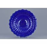 A large Chinese 19th century blue coloured Peking glass dish with lobed sides. Approx. 33cm diameter